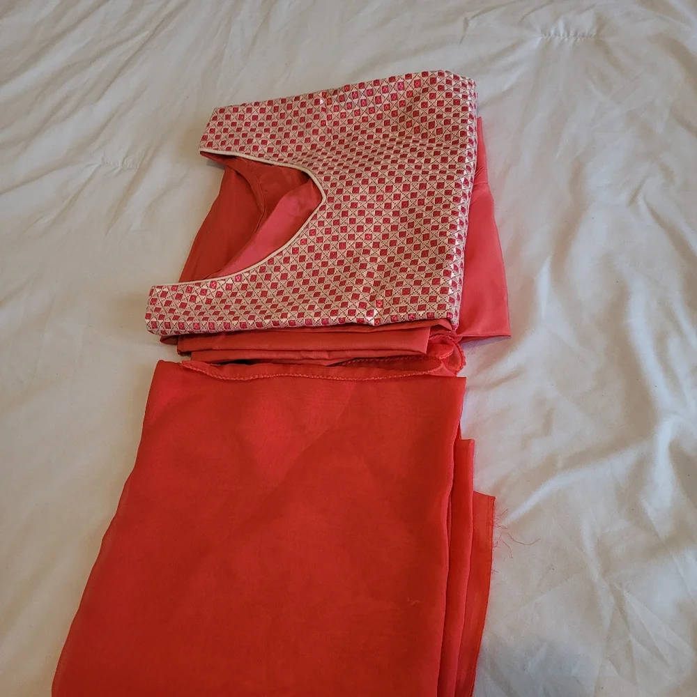 A woman already made clothes with hand made embroidery work on the dress. - Picture 8 of 8